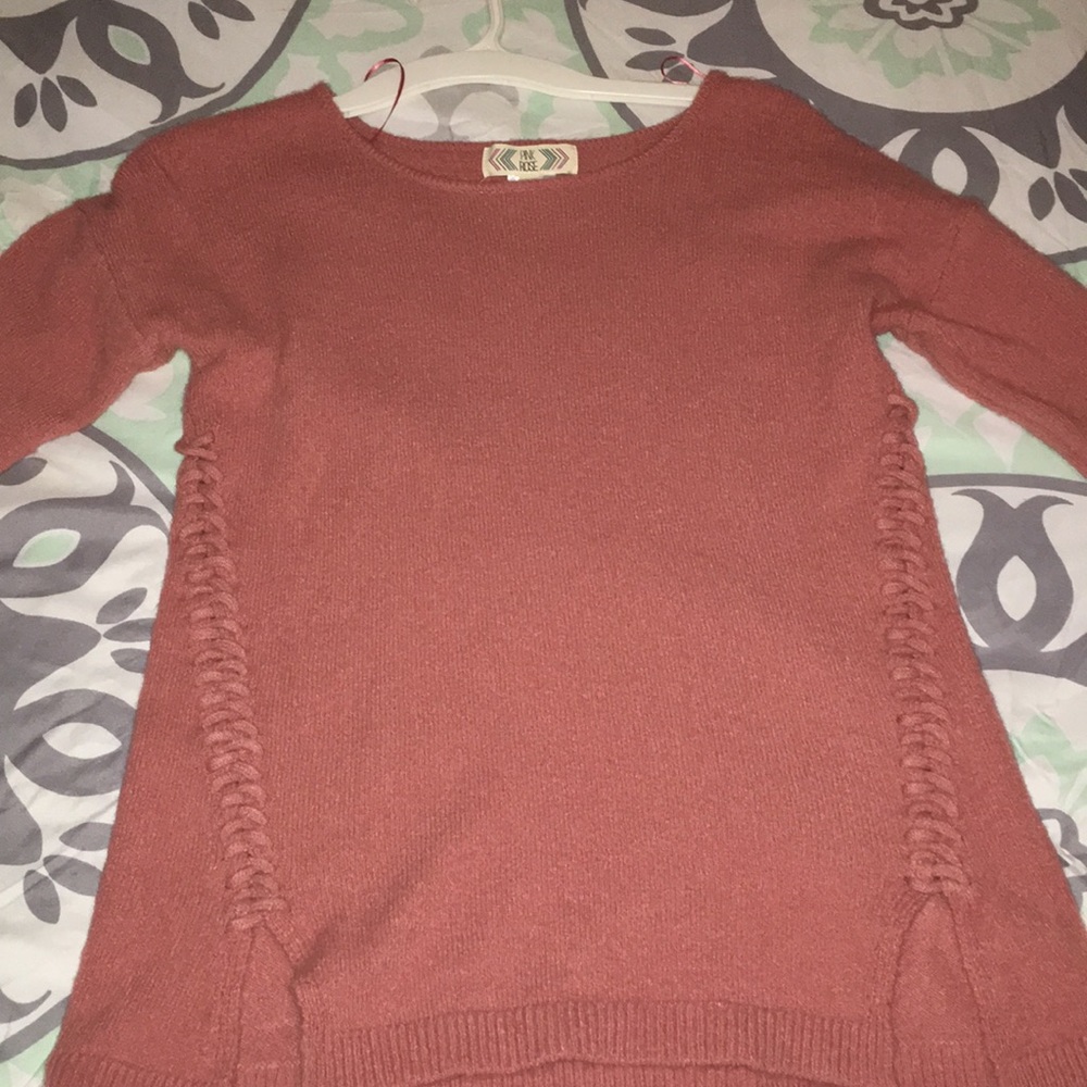 A pink sweater